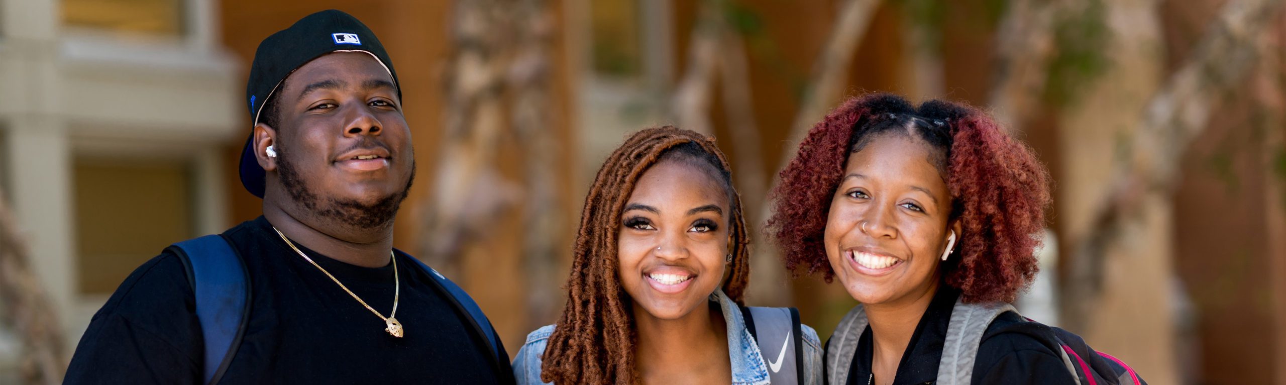 Students smiling outside of HAWAC